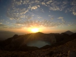 One of the crater lakes in Kelimutu National Park with the sunrise sky above