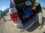 a car with its boot open showing oxygen tanks