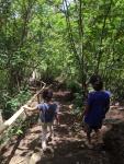Two young girls leading the way along the path from the paddy fields view point.